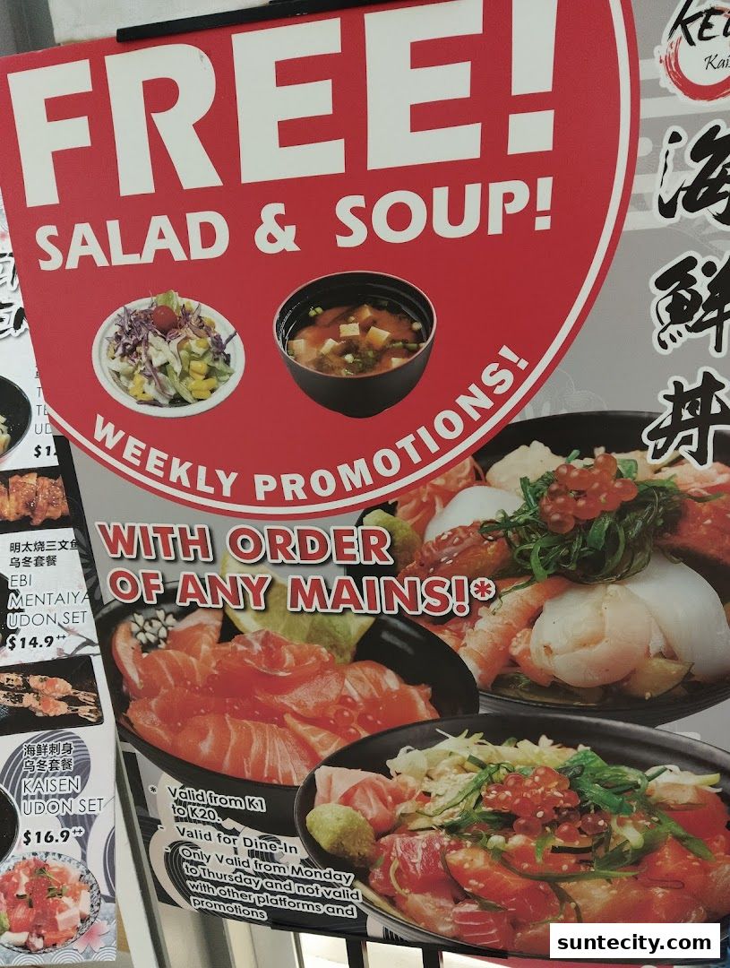 A promotional poster for Kei Kaisendon Suntec City offering free salad and soup with main orders.