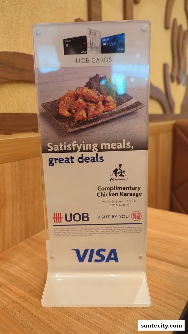 A promotional stand for Kiwami Ramen offering complimentary chicken karaage with UOB cards.