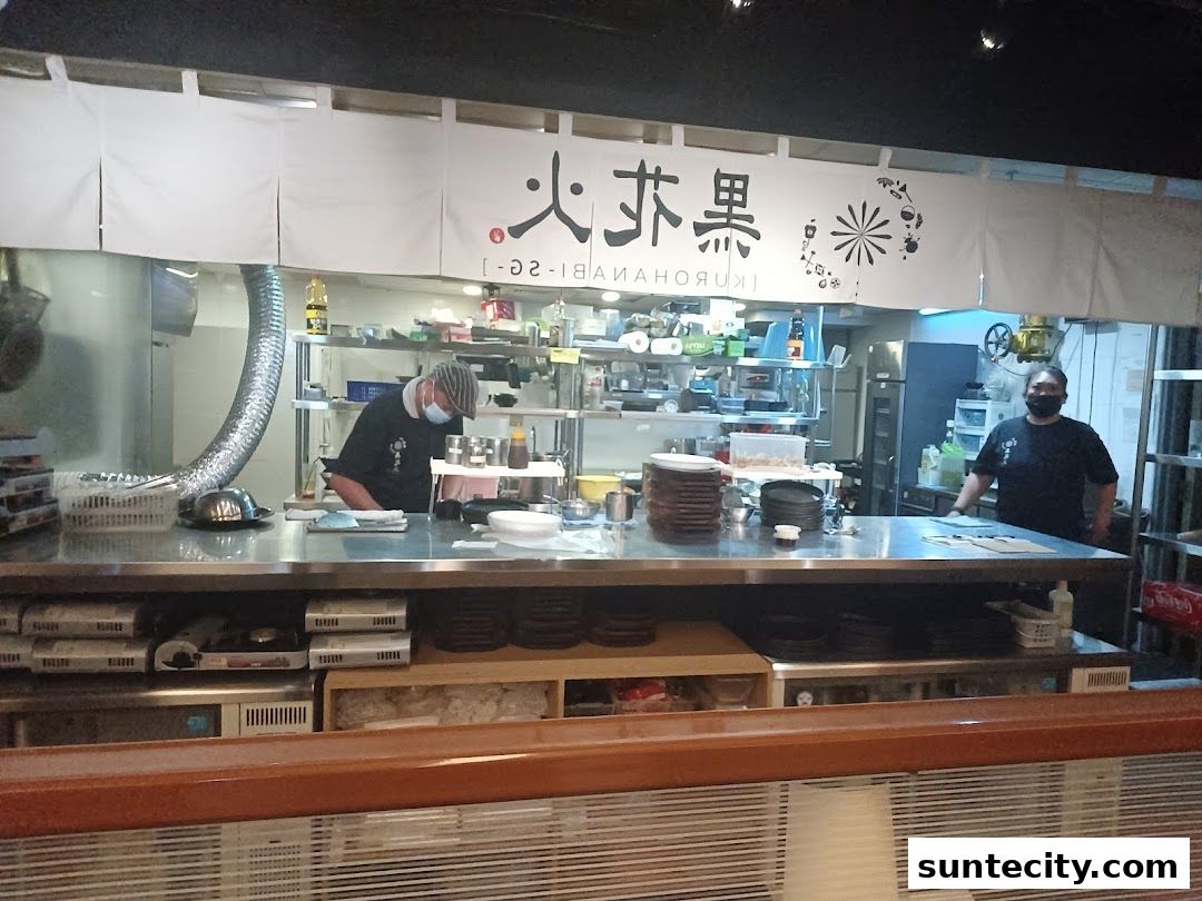 Chefs working behind the counter at Kurohanabi Eat at Seven restaurant.