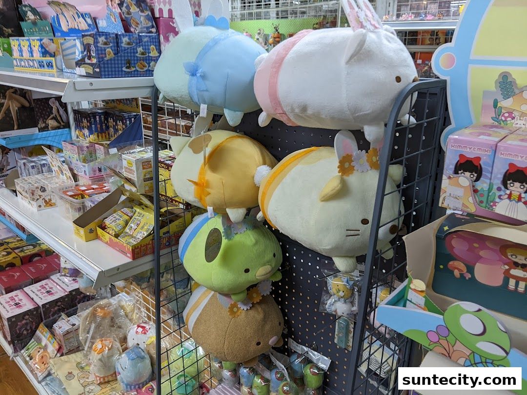 A display of cute, plush toys and various merchandise on shelves in a retail store.