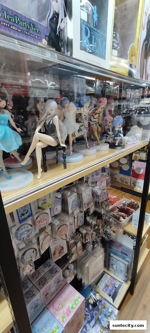 Display shelves filled with anime figurines, merchandise, and collectible items.