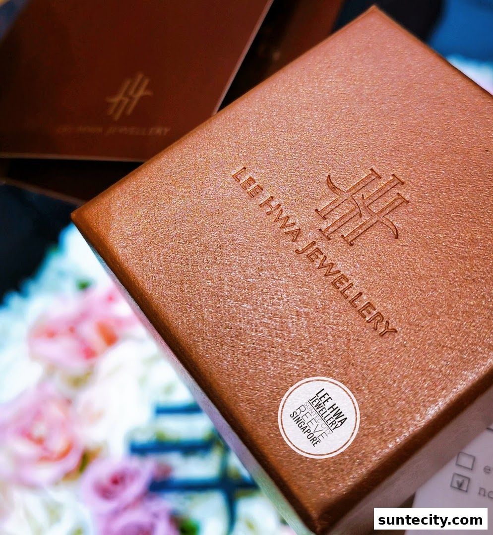 Close-up of a brown jewelry box with the Lee Hwa Jewellery logo and text.