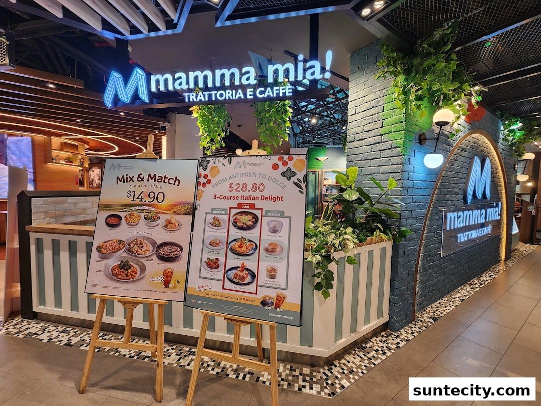The entrance of Mamma Mia Trattoria E Caffè with promotional boards displaying Italian food.