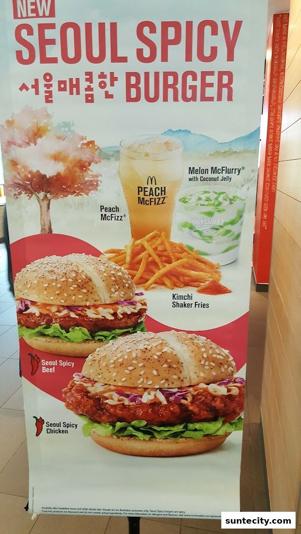 A promotional banner for McDonald's new Seoul Spicy burgers and drinks.
