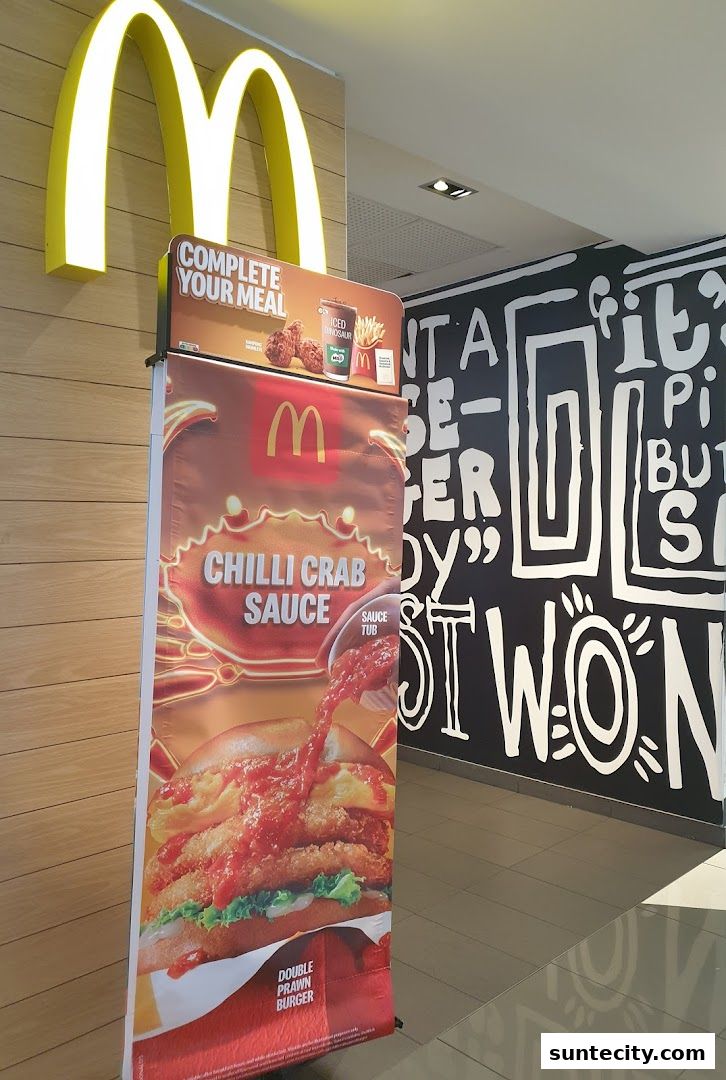 McDonald's promotional banner featuring a Double Prawn Burger with Chilli Crab Sauce.