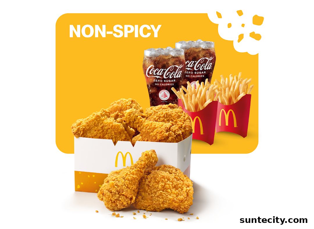 McDonald's non-spicy fried chicken, french fries, and Coca-Cola Zero Sugar drinks.