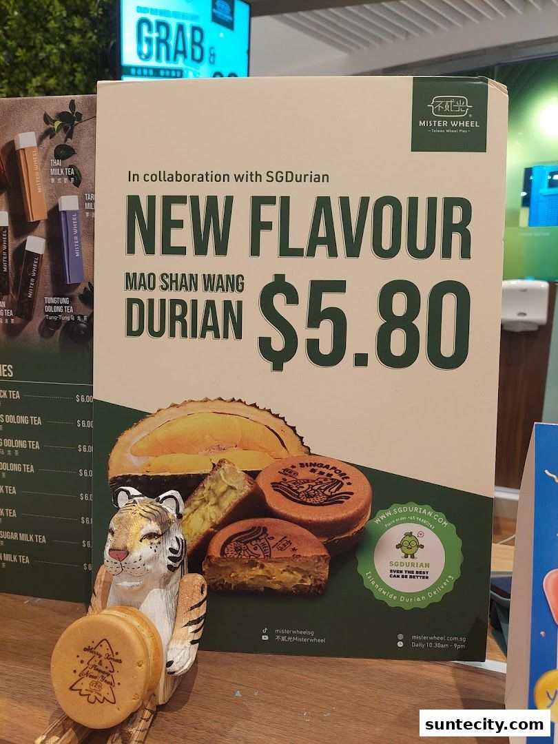 A promotional sign for Mister Wheel's new Mao Shan Wang Durian flavor wheel pies.