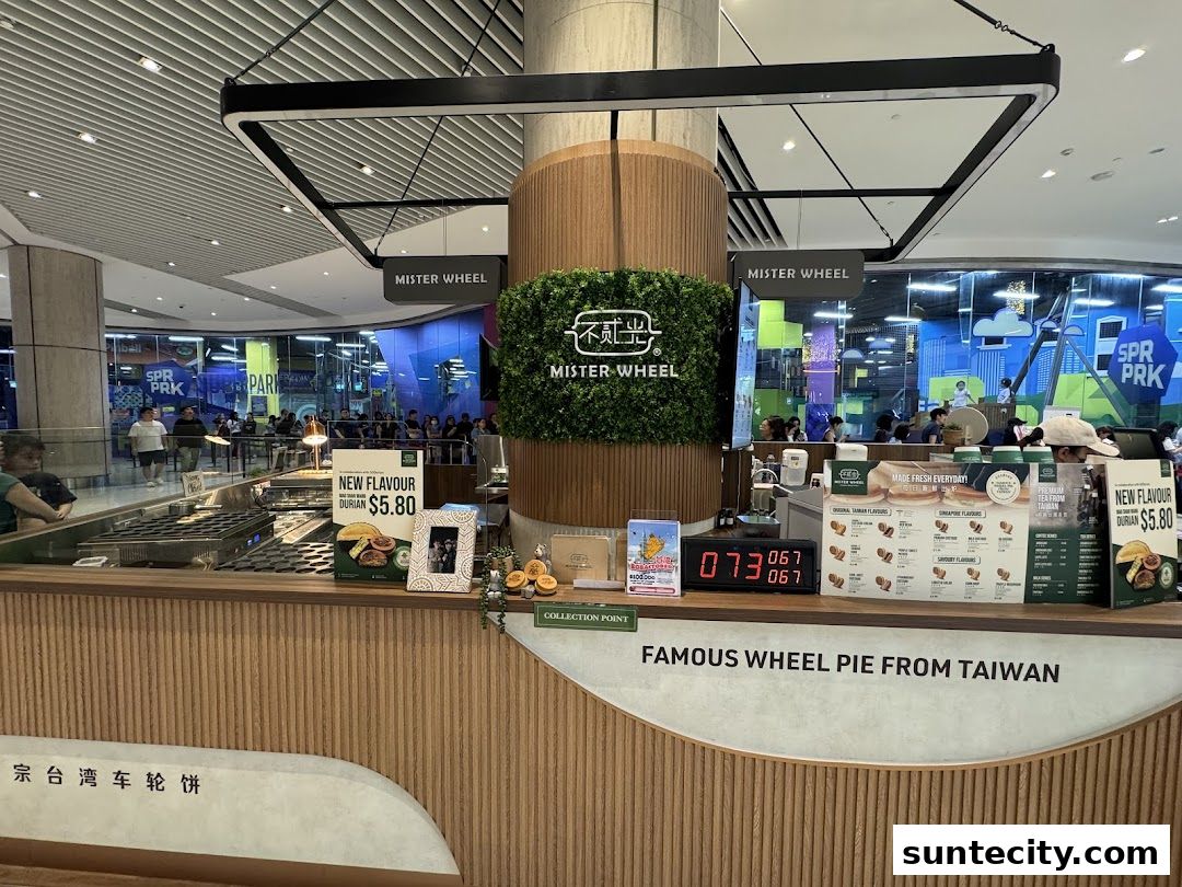 A counter display for Mister Wheel Singapore, featuring wheel pies and a new durian flavor.