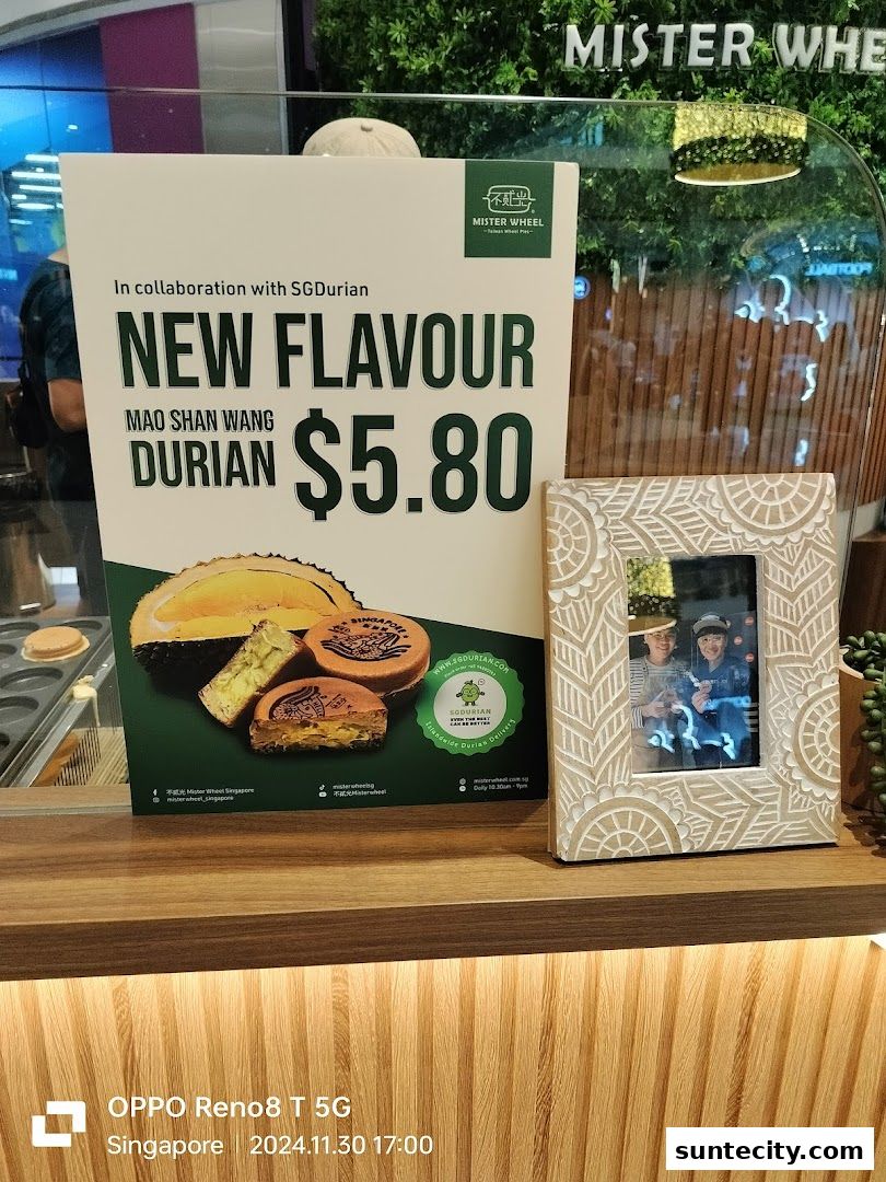 A sign advertises a new Mao Shan Wang Durian flavor for $5.80 at Mister Wheel.