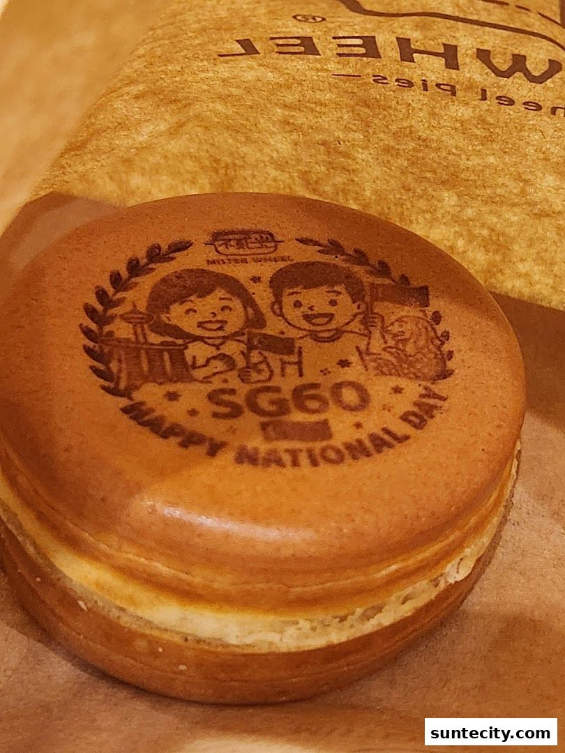A close-up of a Japanese wheel cake with a festive National Day design.