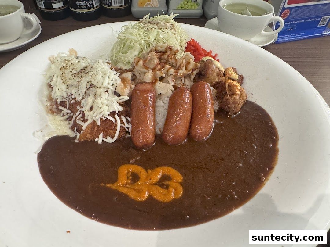 A large plate of Japanese curry with rice, topped with cheese, sausages, and fried chicken.