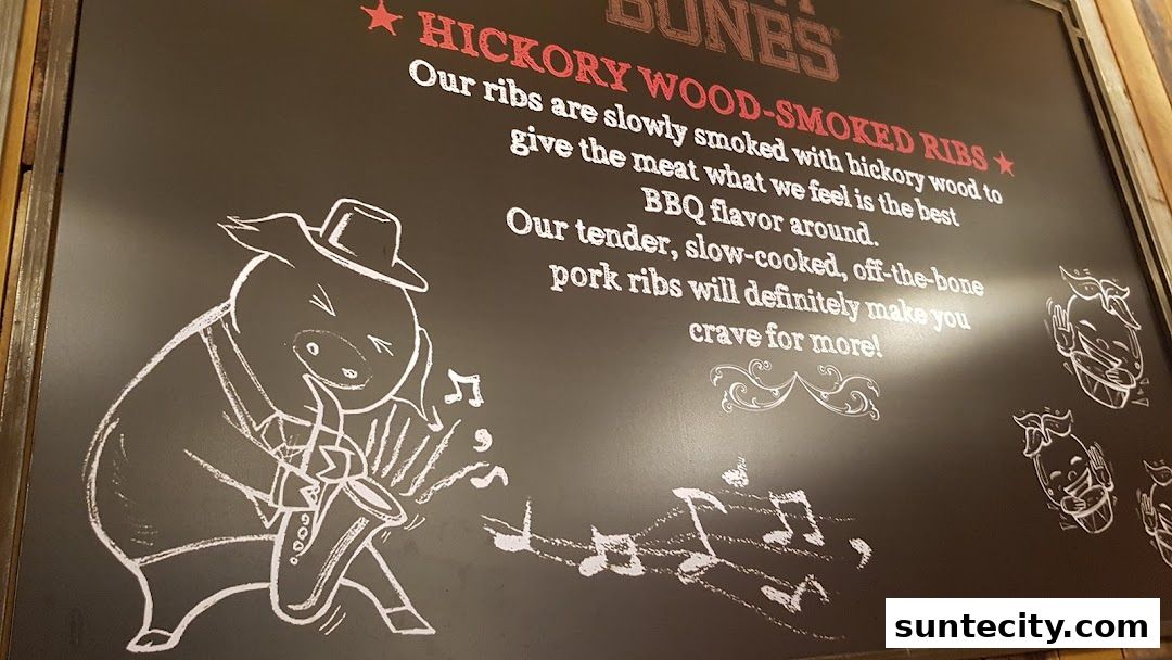 A chalkboard sign advertising hickory wood-smoked ribs with a cartoon pig playing a saxophone.
