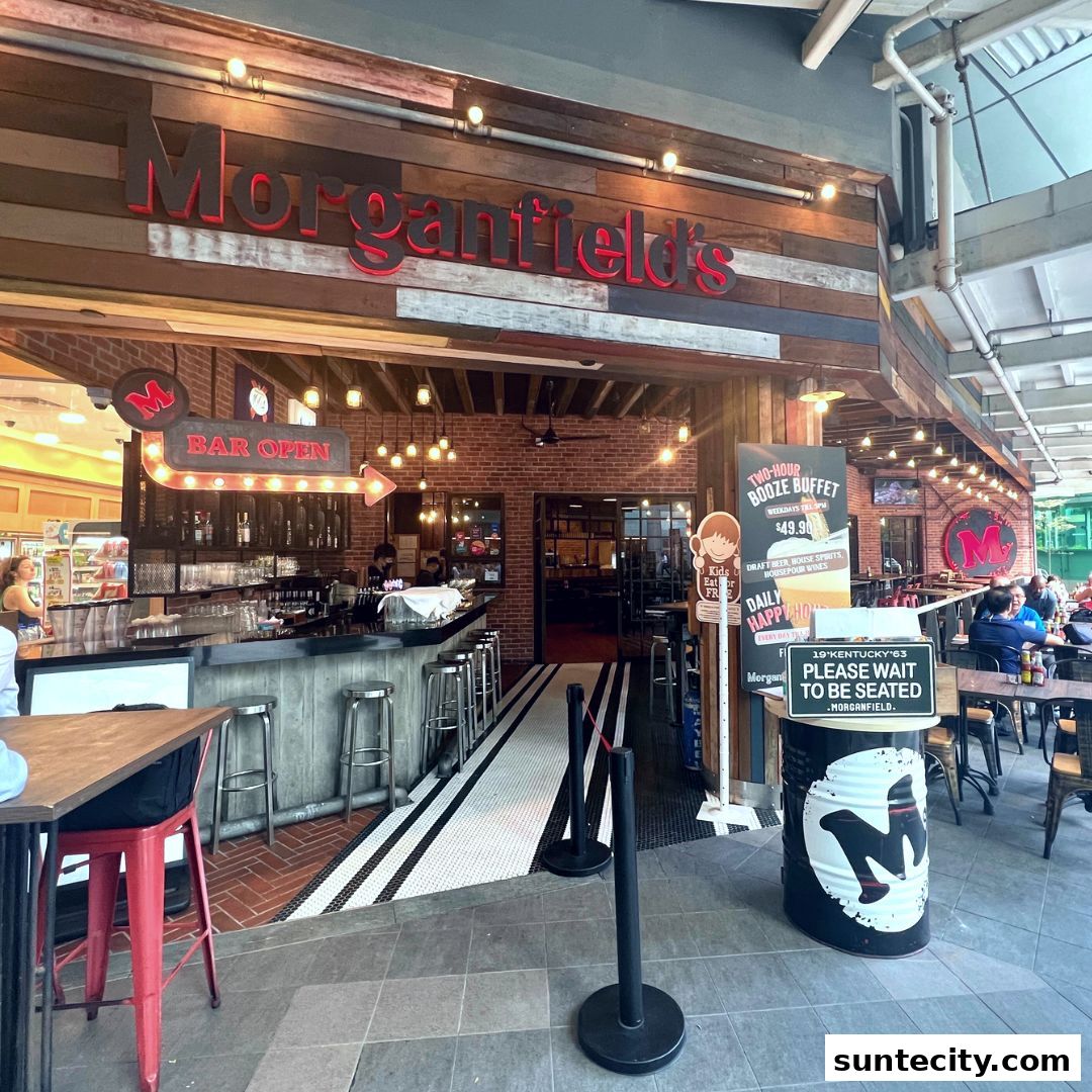 The exterior of Morganfield's restaurant with a bar and seating area visible.