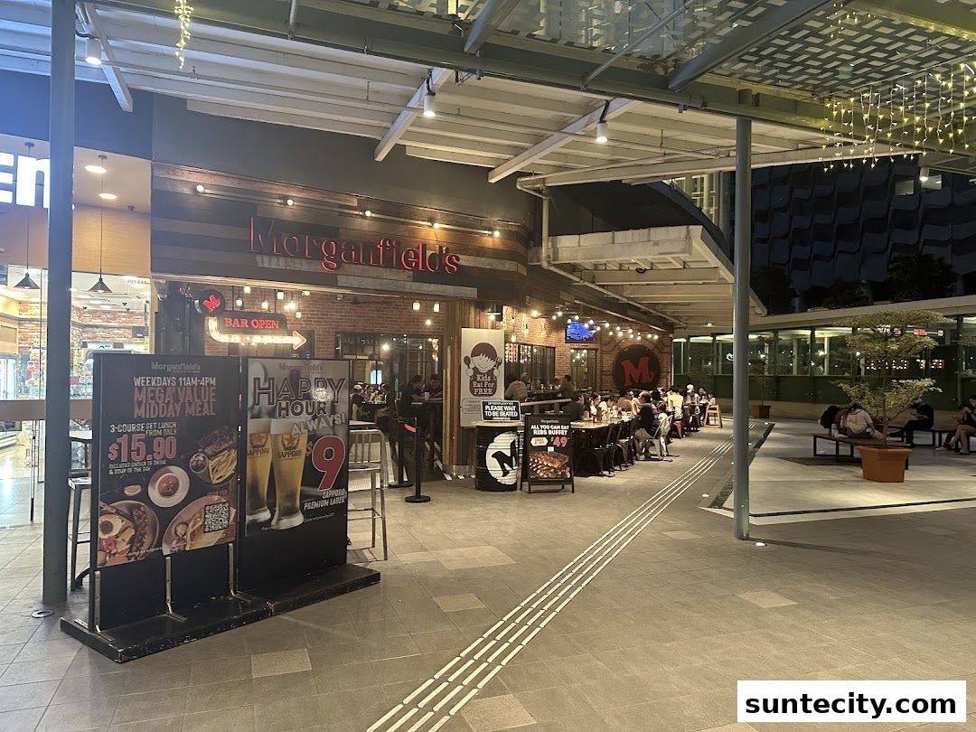 The exterior of Morganfield's restaurant with outdoor seating and promotional displays.