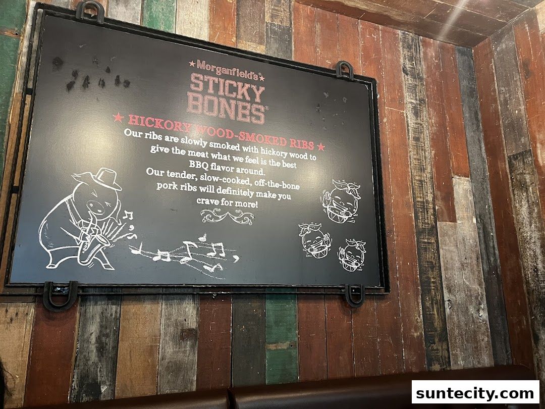 A sign advertising Morganfield's Sticky Bones Hickory Wood-Smoked Ribs.