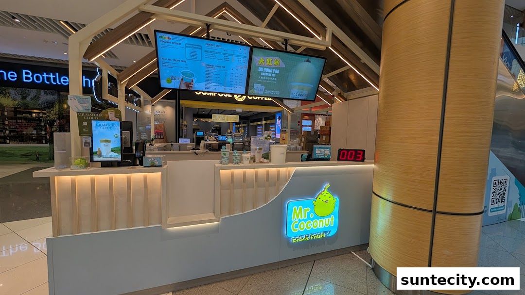 The Mr. Coconut shop front with illuminated menus and a prominent logo.