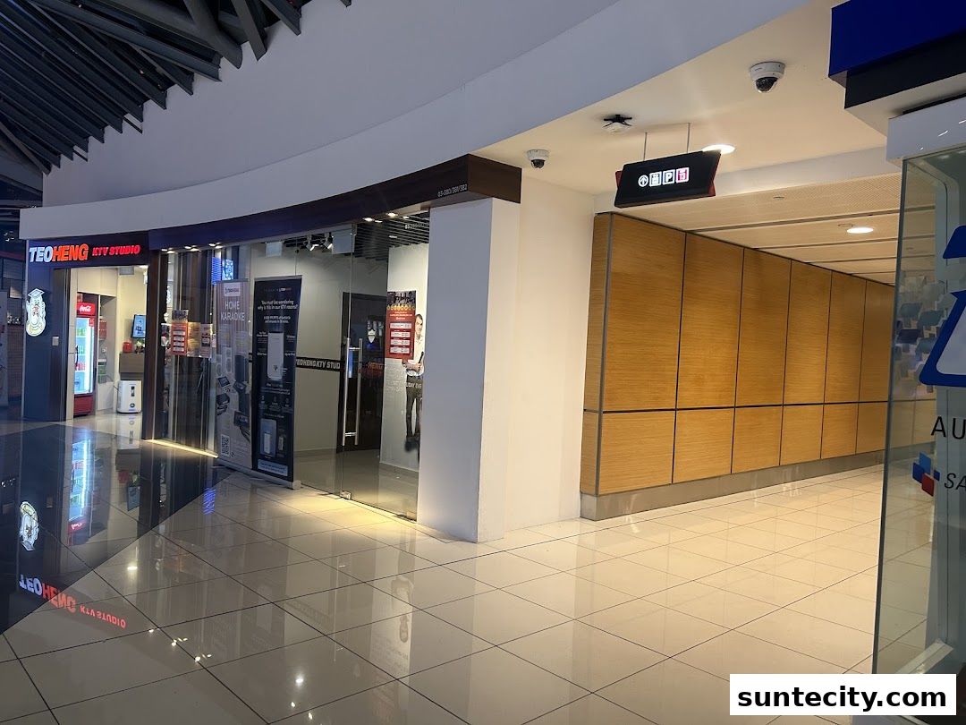 The exterior of a KTV studio with a glass entrance and illuminated signage.