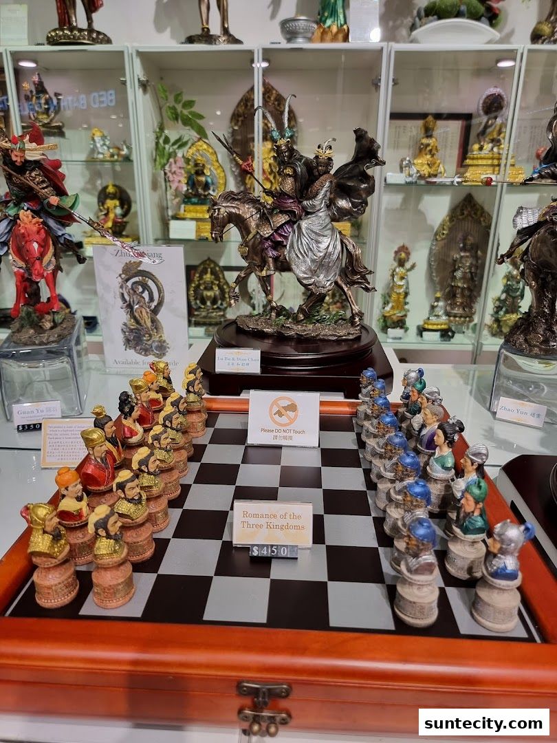 A display of intricately designed chess sets and figurines, featuring historical and mythical figures.