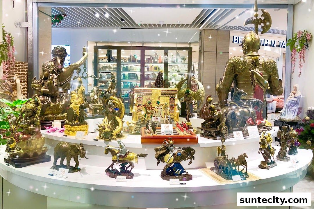 A shop window display featuring a variety of ornate statues and figurines, including knights, dragons, and mythological figures.