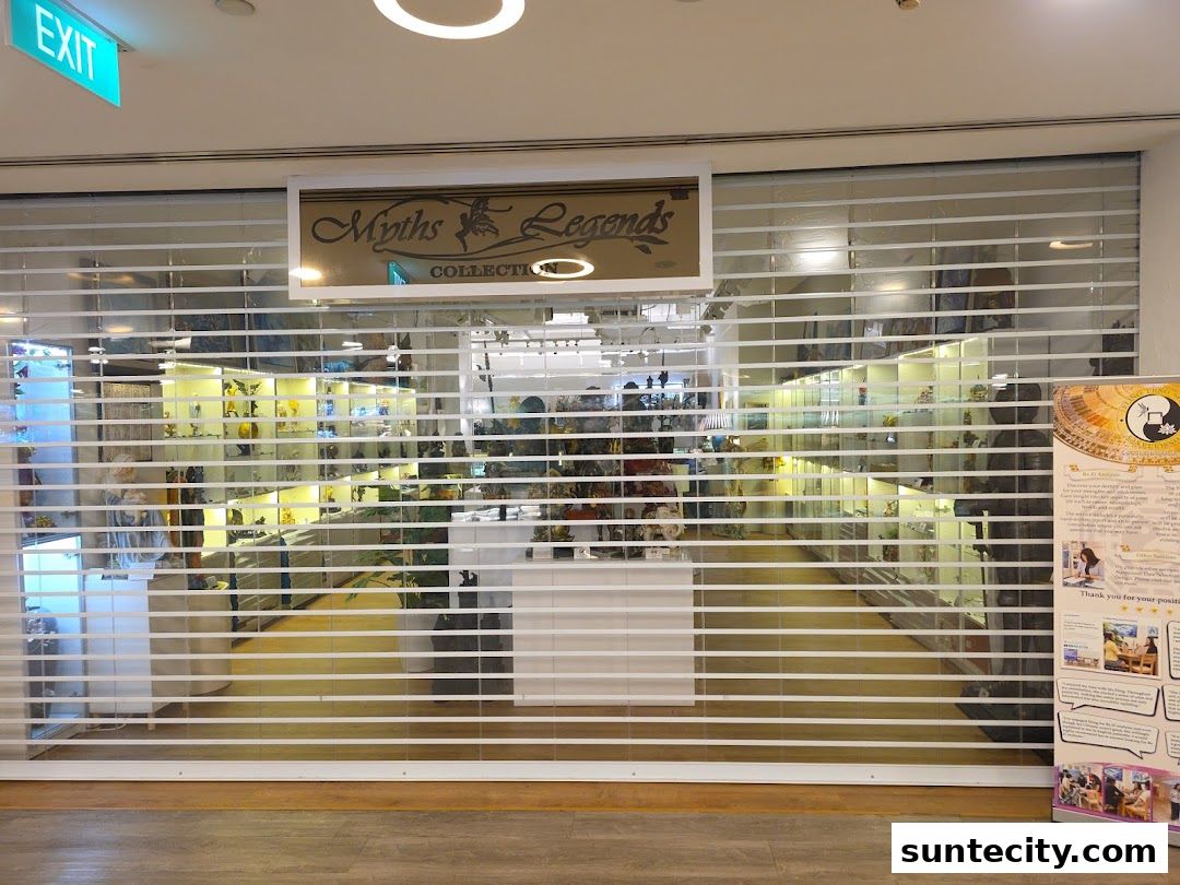 The closed storefront of Myths & Legends Collection, displaying various items on shelves.