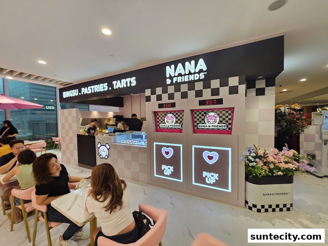 Interior of Nana and Friends Cafe with customers seated and staff behind the counter.
