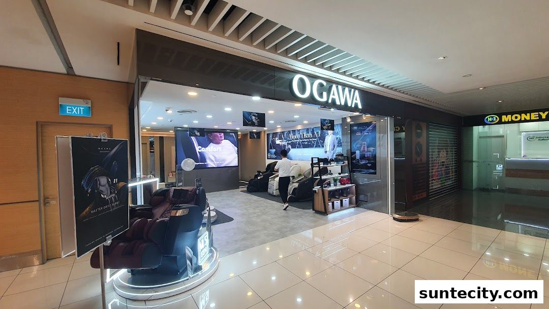 The Ogawa shop front displays massage chairs and promotional screens inside a mall.