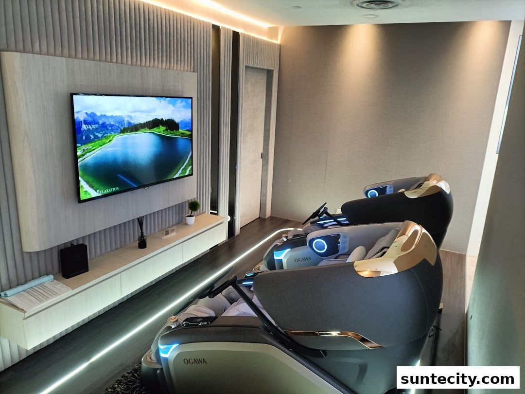 Interior view of a modern Ogawa massage chair store with two chairs and a TV.