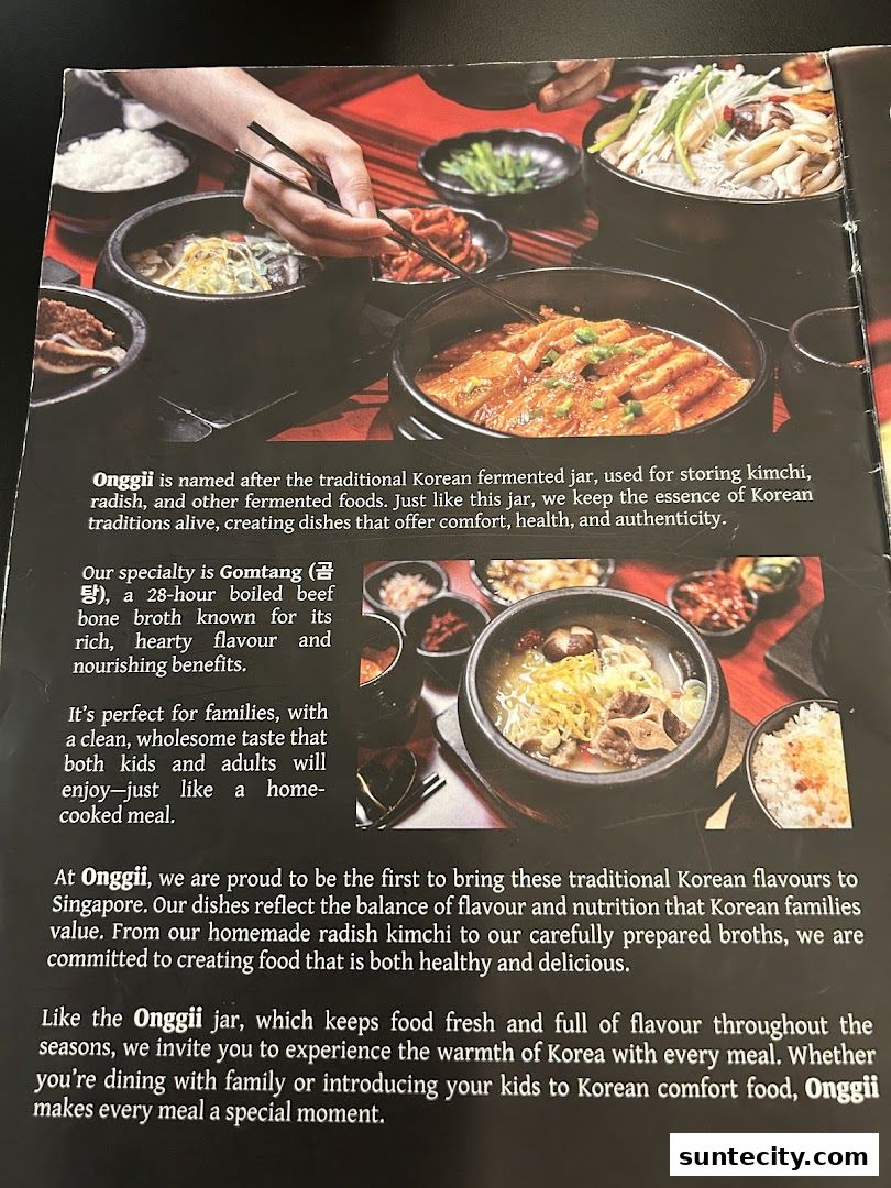 A spread of delicious Korean dishes, including Gukbap and kimchi, served in traditional stone pots.
