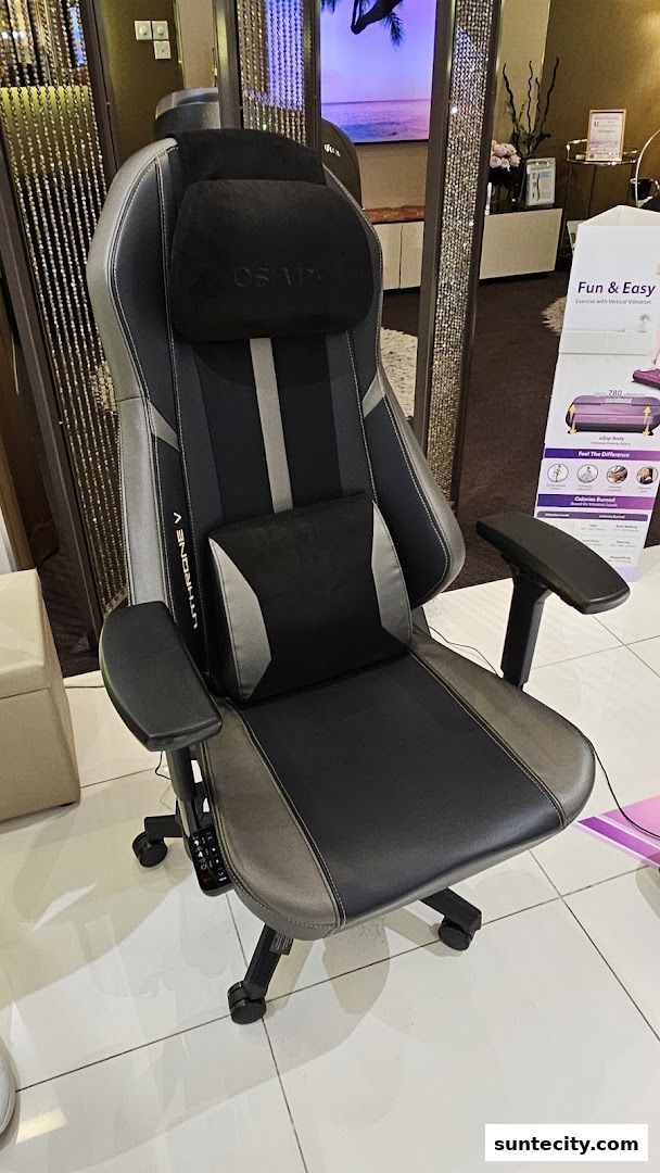 A black and grey ergonomic massage chair with the OSIM logo on the headrest.