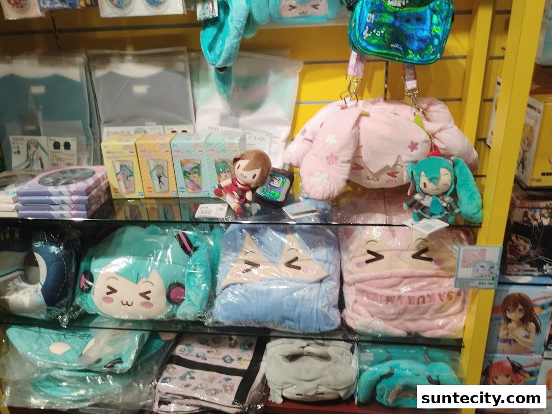 A retail display shelf filled with anime-themed plush toys, bags, and merchandise.