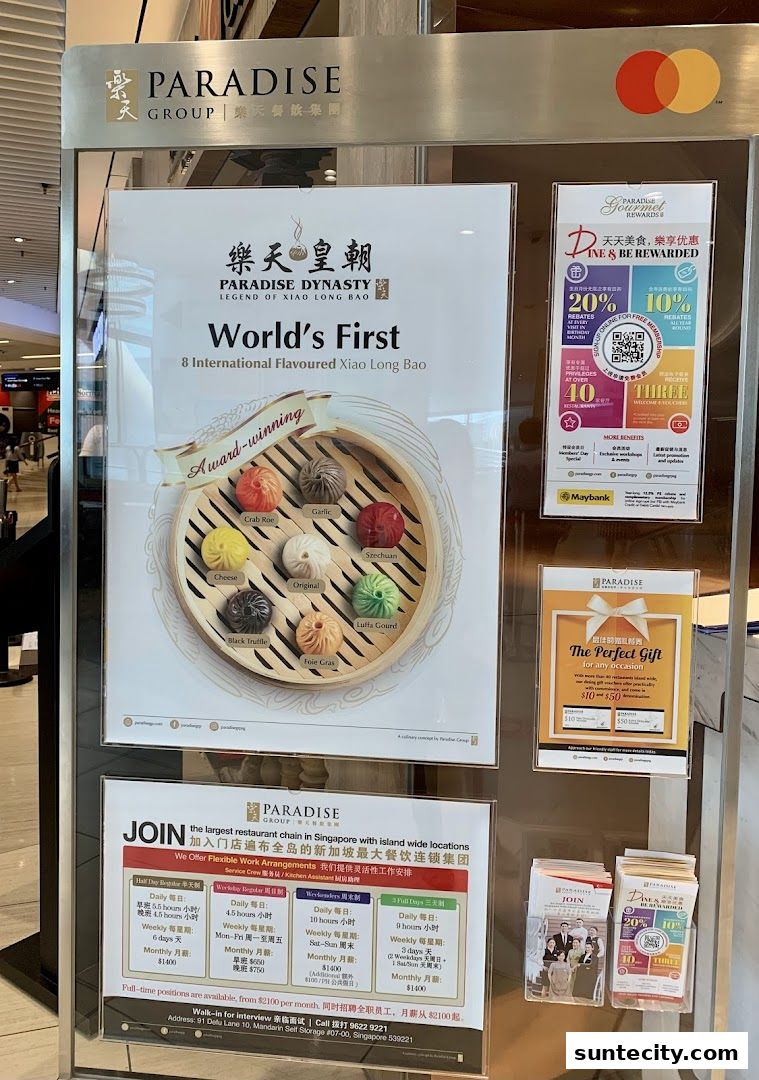 A display board outside Paradise Dynasty at Suntec City, showcasing their award-winning Xiao Long Bao and job opportunities.