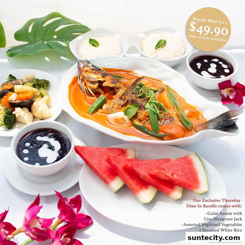 A delicious meal for two featuring a whole fish in curry, rice, vegetables, and fruit.