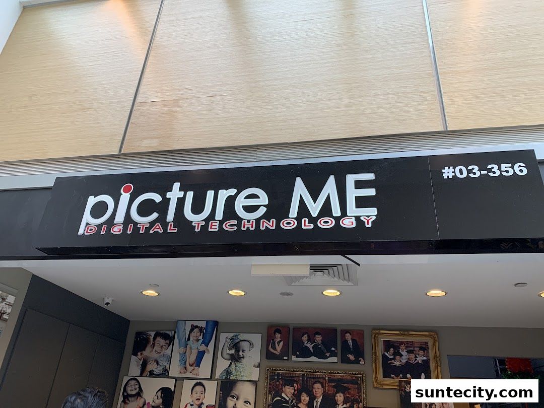 The 'Picture Me' shop front with its logo and displayed photographs.