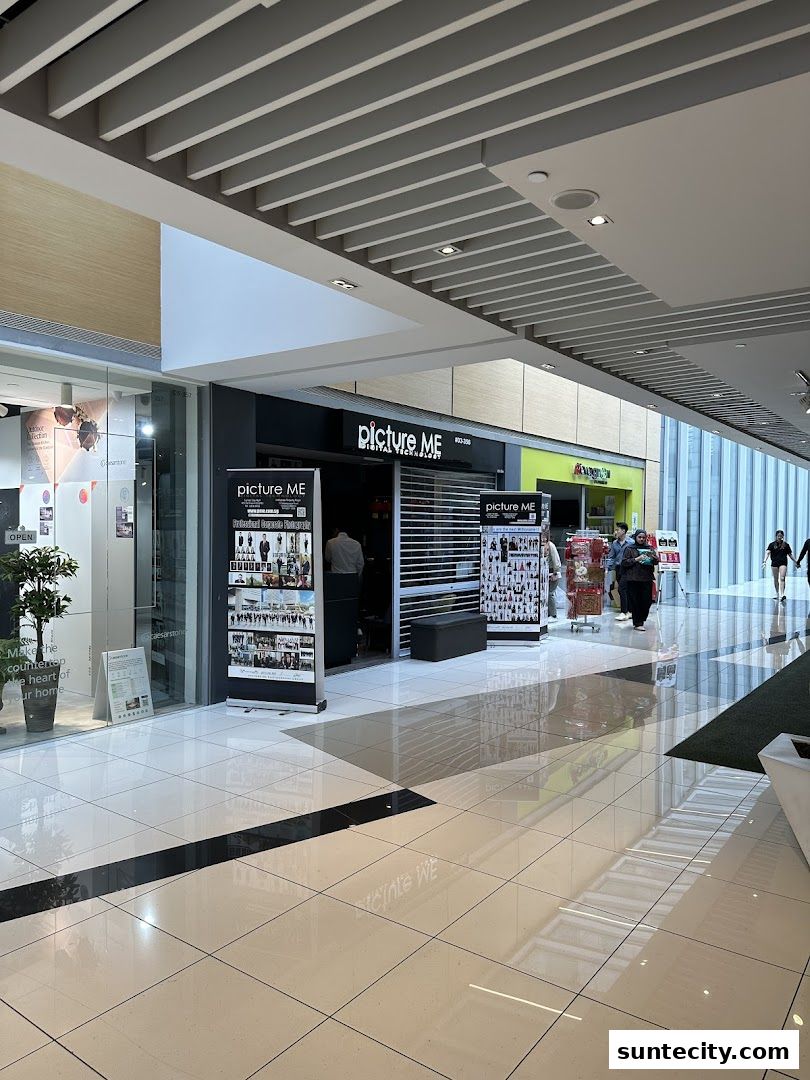 The exterior of the 'Picture Me' shop in a modern shopping mall.