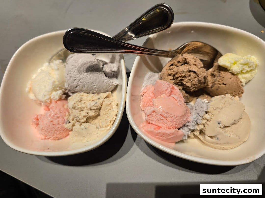 Two bowls of assorted ice cream flavors with spoons.
