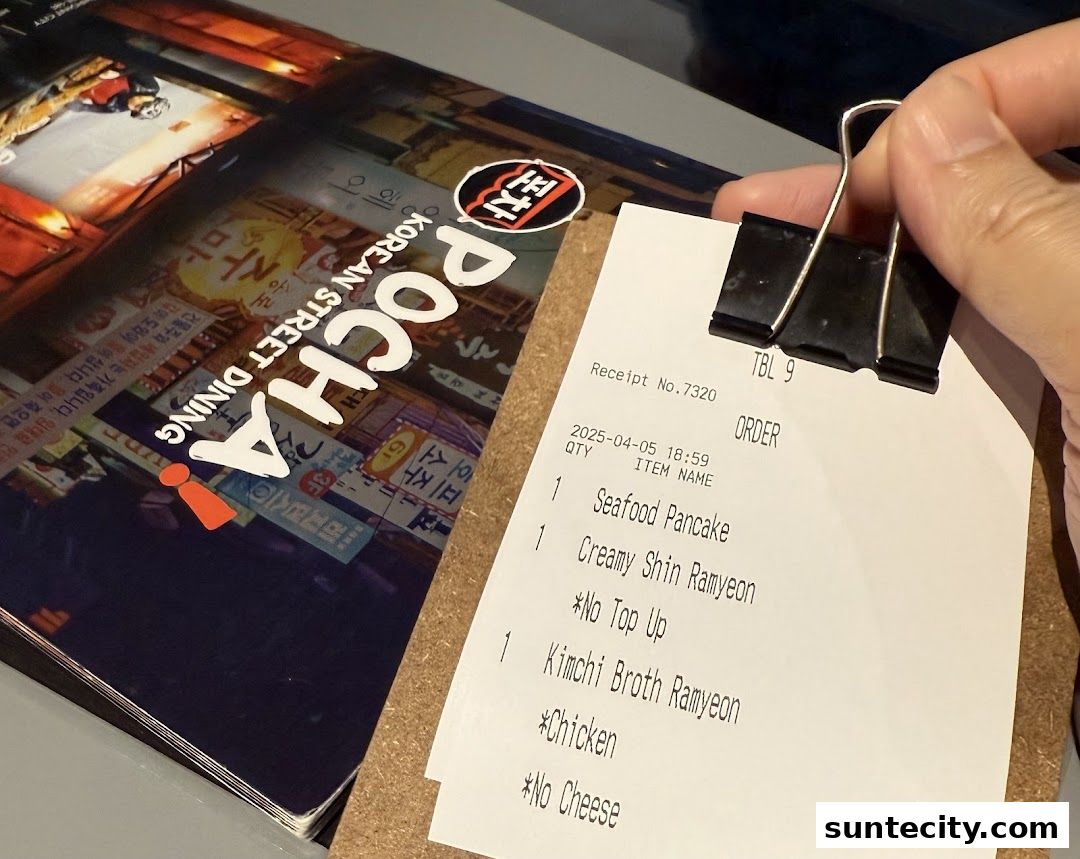 A receipt from POCHA! Korean Street Dining with menu items listed.