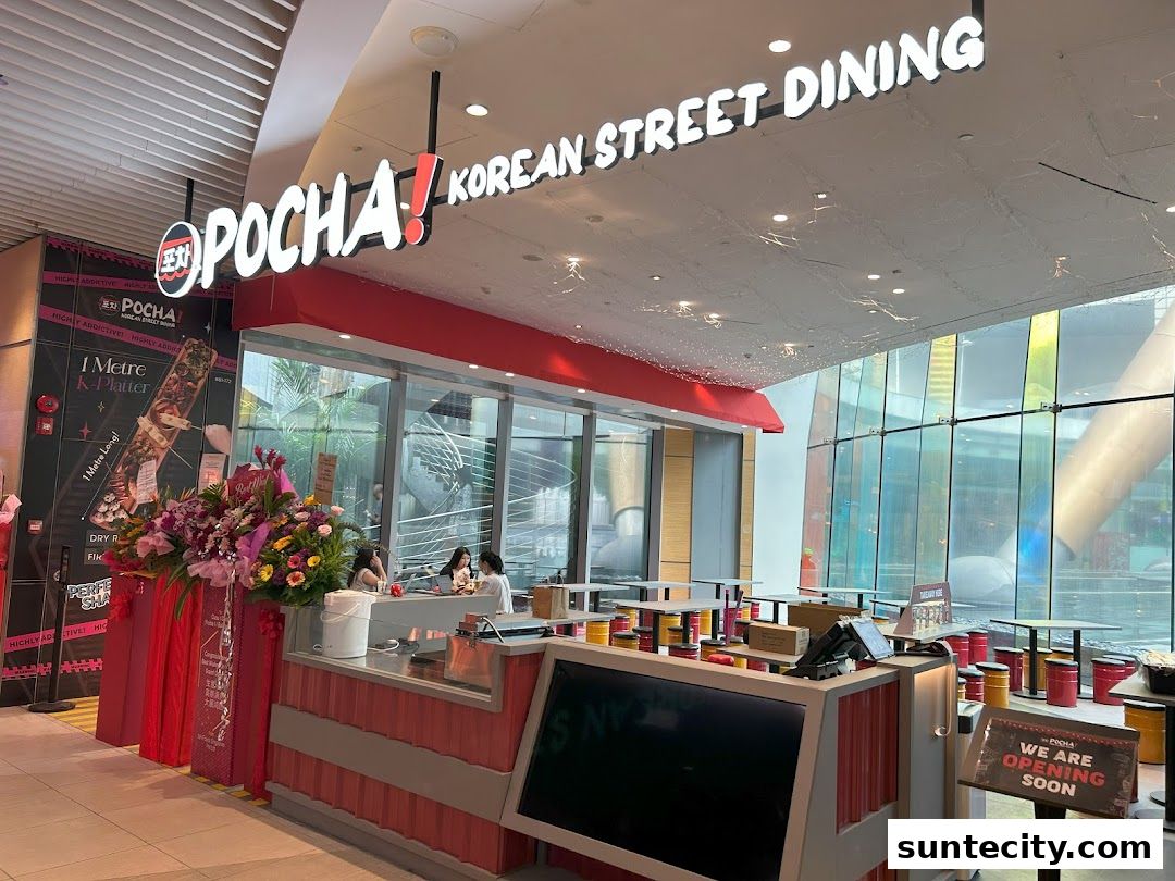 The exterior of POCHA! Korean Street Dining with its prominent signage and interior seating visible.