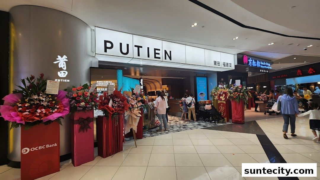 The entrance of PUTIEN restaurant decorated with congratulatory flower stands.