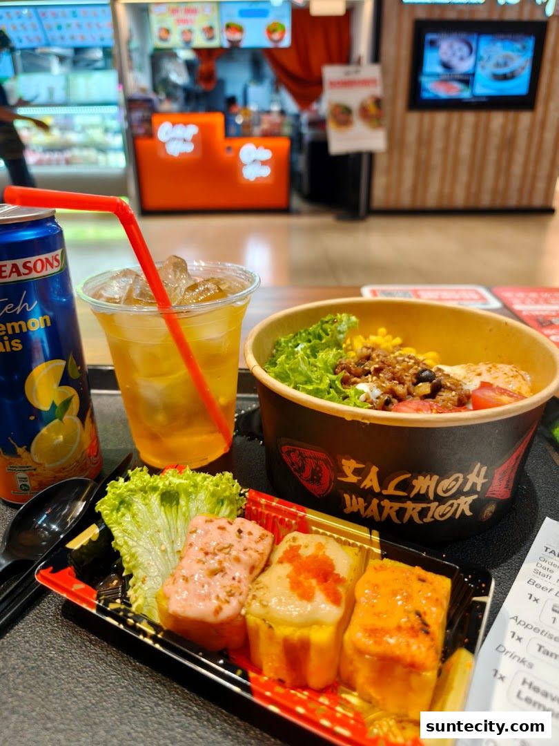 A meal from Salmon Warrior featuring a salmon bowl, sushi, and a canned drink.