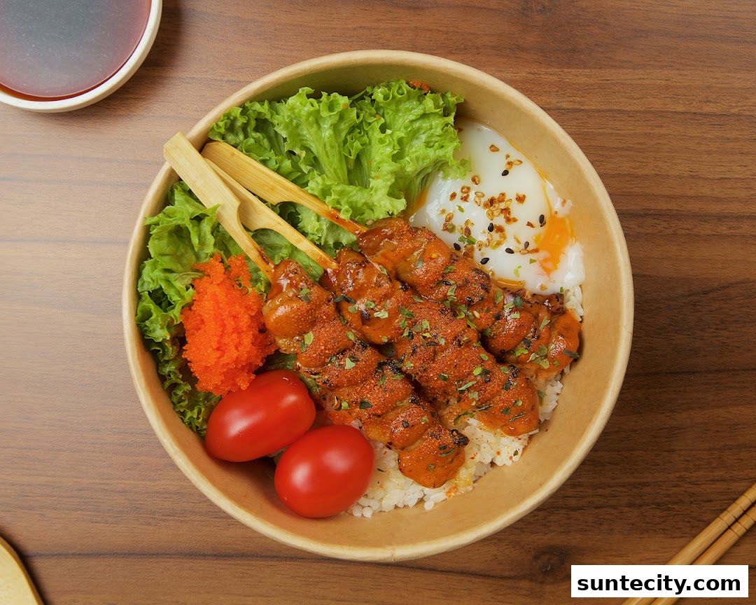 A delicious bowl of rice with grilled chicken skewers, a soft-boiled egg, and fresh vegetables.