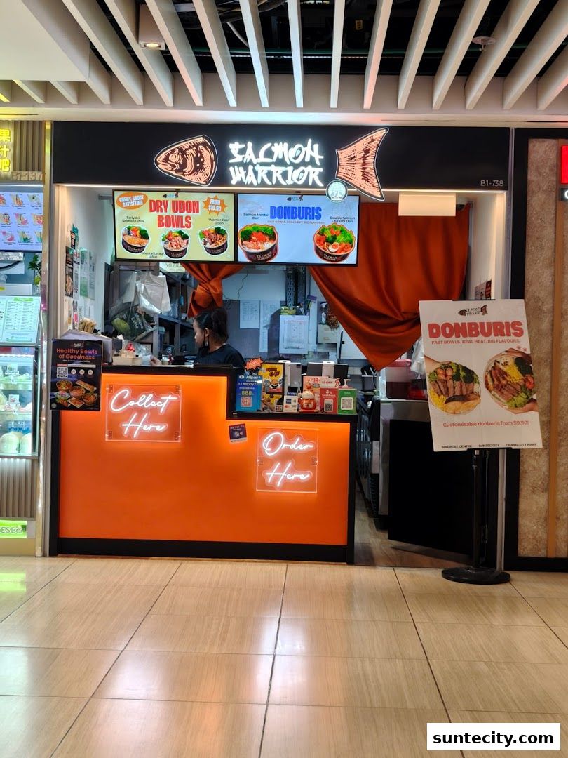 Salmon Warrior shop front with digital menus displaying Udon Bowls and Donburis.