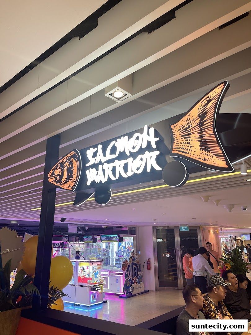 The Salmon Warrior shop sign is displayed prominently with a fish design and neon lighting.