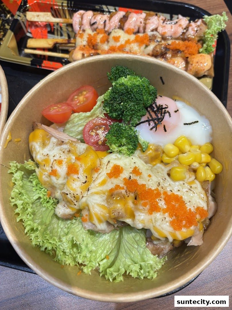 A close-up of a salmon bowl with cheese, corn, and a soft-boiled egg, with skewers of salmon in the background.