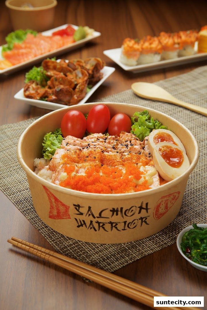 A delicious salmon poke bowl with fresh ingredients and a side of seaweed salad.