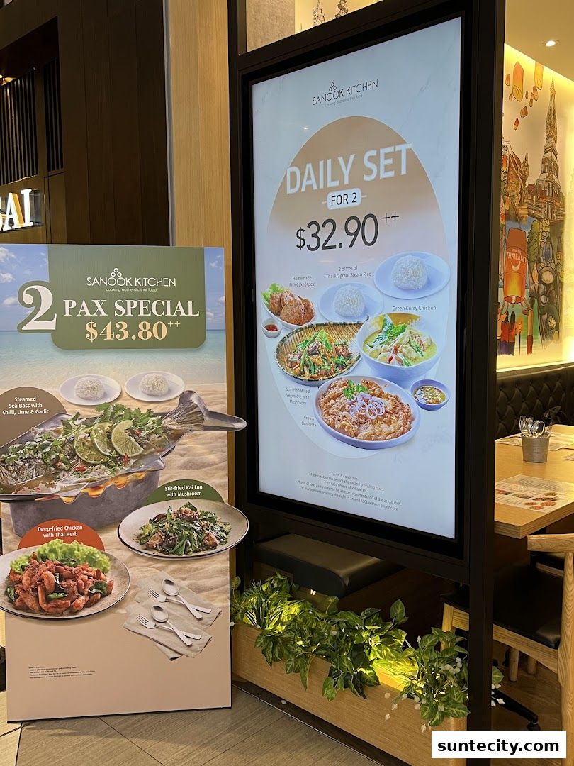 Promotional posters for Sanook Kitchen featuring Thai food specials and set meals.
