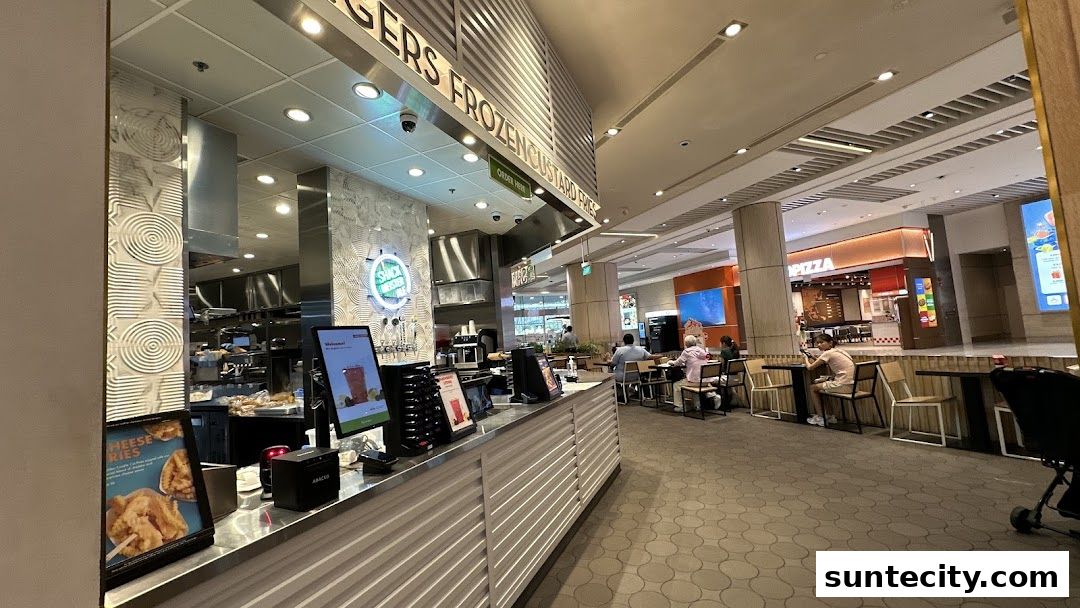 Interior view of Shake Shack Suntec with customers dining and ordering at the counter.