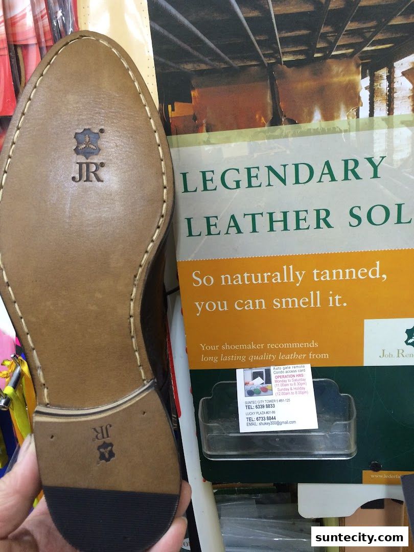 A close-up of a leather shoe sole with the JR logo, next to a display about legendary leather soles.