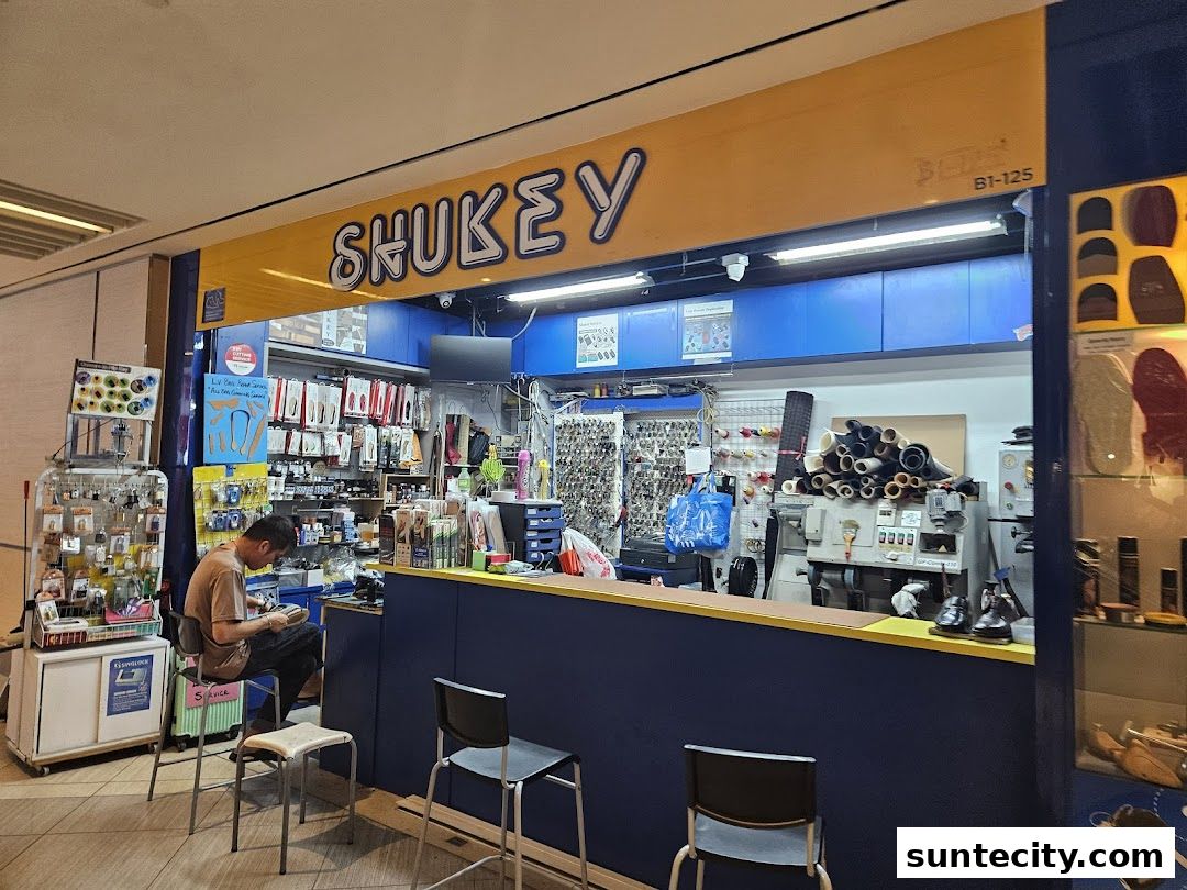 A shoe repair and key cutting shop with a variety of tools and supplies displayed.