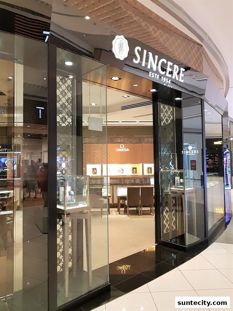 The exterior of Sincere Fine Watches, a luxury watch retailer, with display cases visible inside.