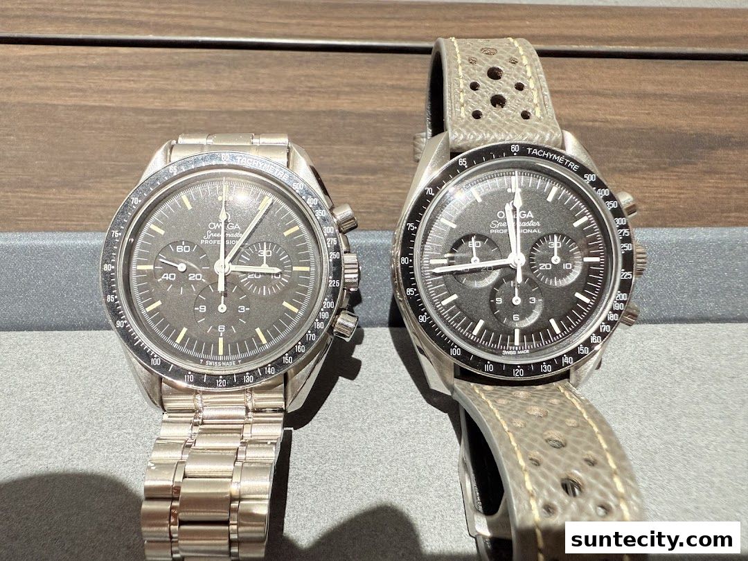Two Omega Speedmaster watches, one with a metal bracelet and one with a perforated leather strap.